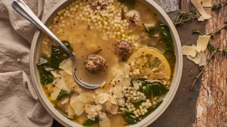 big bowl of Italian wedding soup with ladel
