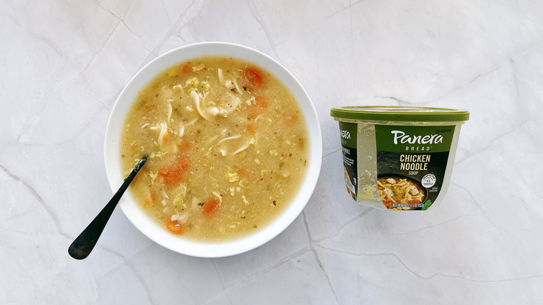 bowl of soup and container of panera soup