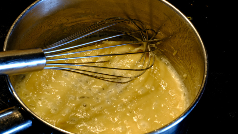 Making a roux in a saucepan from flour and butter