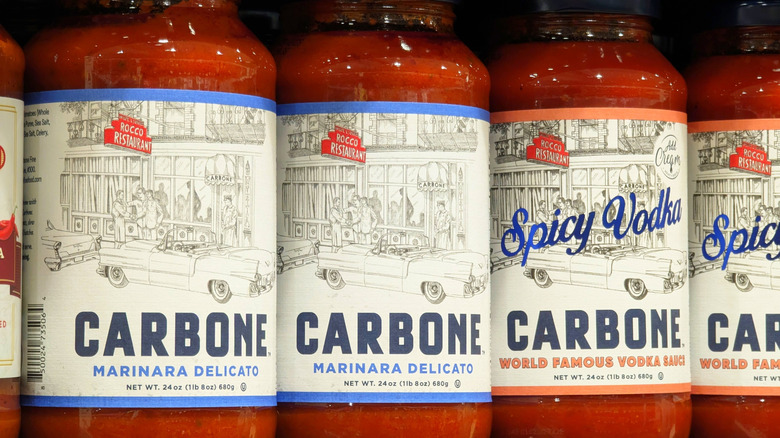 Jars of marinara sauce on grocery shelf