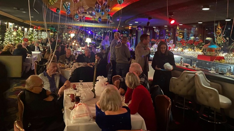 Dining room with crowds of people and balloons