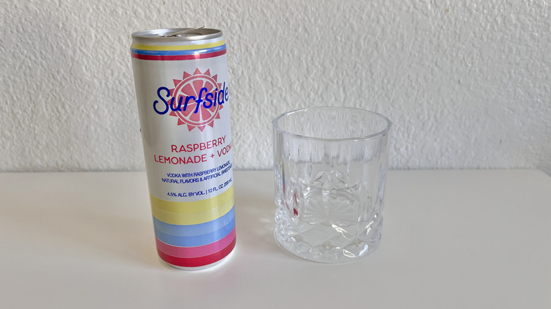 Raspberry Lemonade + Vodka poured into a glass