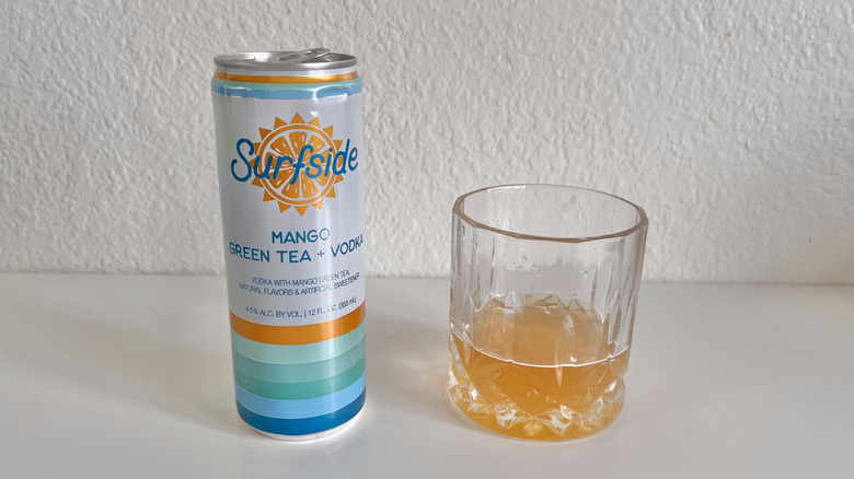 Mango Green Tea + Vodka poured into a glass
