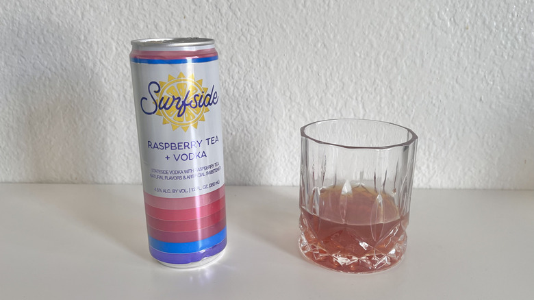 Raspberry Tea + Vodka poured into a glass