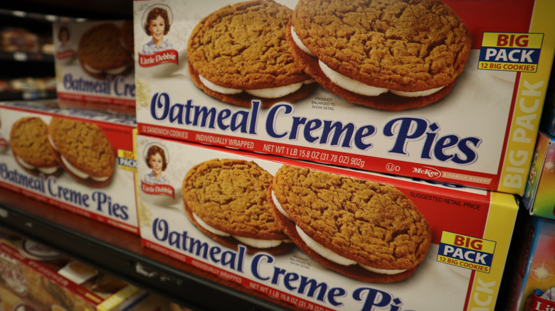 Little Debbie oatmeal creme pie boxes on a grocery store shelf