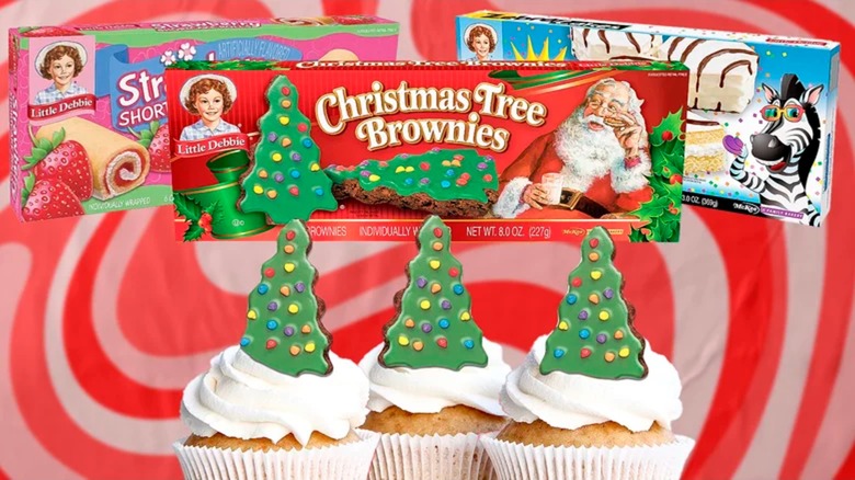 Cupcakes topped with Christmas tree brownies with other example snack cake boxes