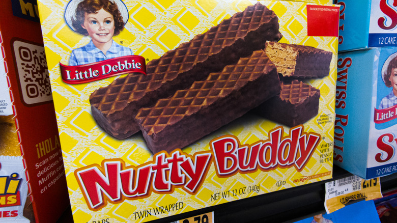 Little Debbie oatmeal creme pies and nutty buddies on a store shelf