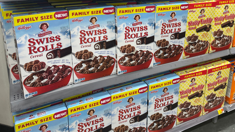 Grocery store display of Swiss rolls and Nutty Buddy cereal boxes