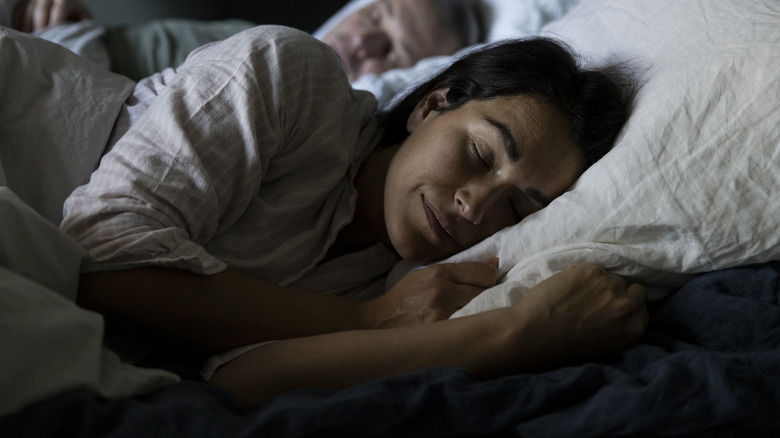 Two people sleeping restfully