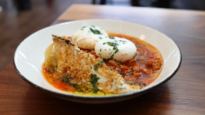 Poached Eggs | conical cabbage, Italian sausage, peperonata, pecorino fonduta, fennel pollen