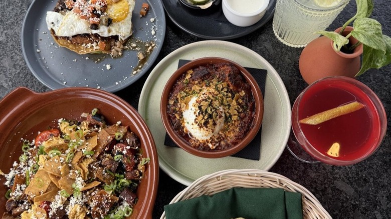 restaurant table with a variety of mexican dishes