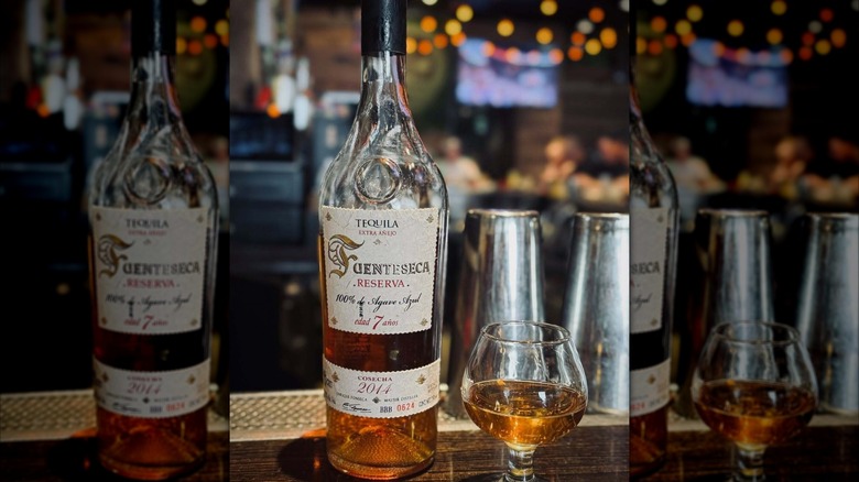 A bottle of Fuenteseca 7 Year with a glass of the tequila