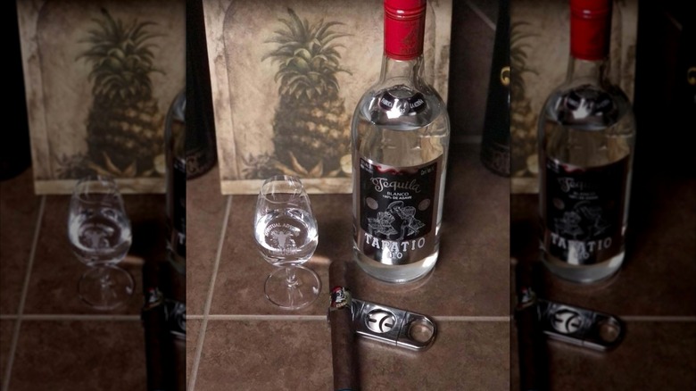 Bottle of Tapatio 110 and a cigar