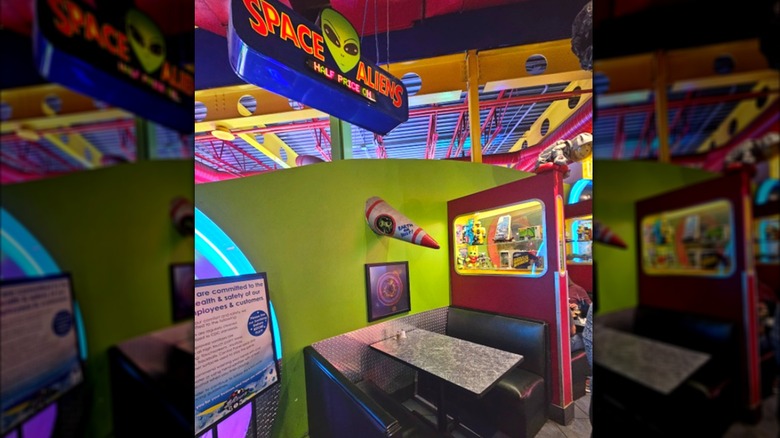 A booth inside the colorful Space Aliens Grill & Bar
