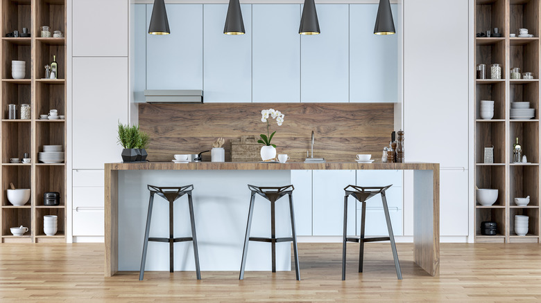 Modern hardwood kitchen with blue cabinets and island
