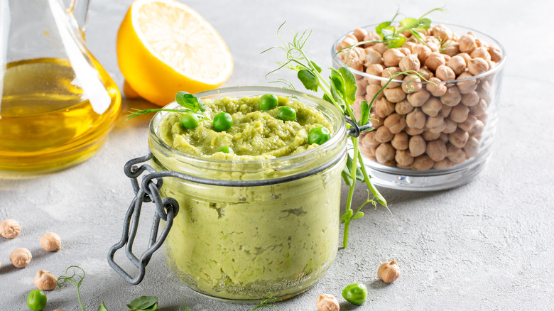 Glass jars of blended avocado and chickpeas