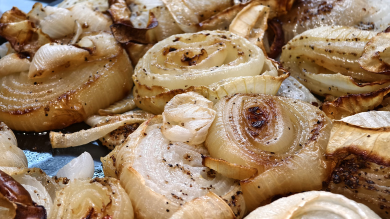 A close up of roasted garlic and onions