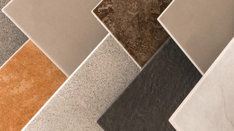 Several samples of flooring materials displayed vertically