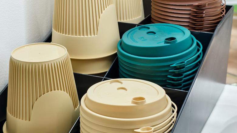 Takeout containers and lids organized in separate piles
