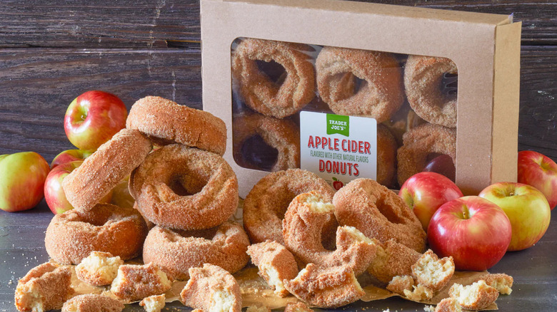 Trader Joe's Apple Cider Donuts scattered on table in front of box