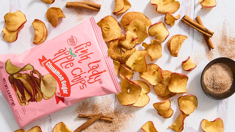 bag of Trader Joe's Pink Lady Apple Chips opened and spilled across white table
