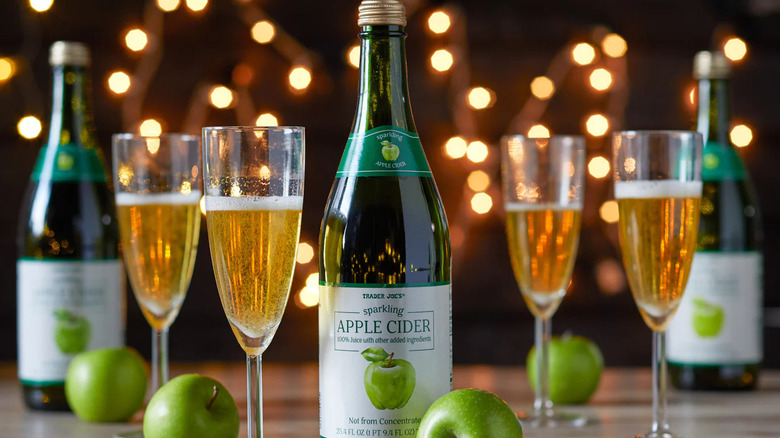 a bottle of Trader Joe's Sparkling Apple Cider and champagne flutes
