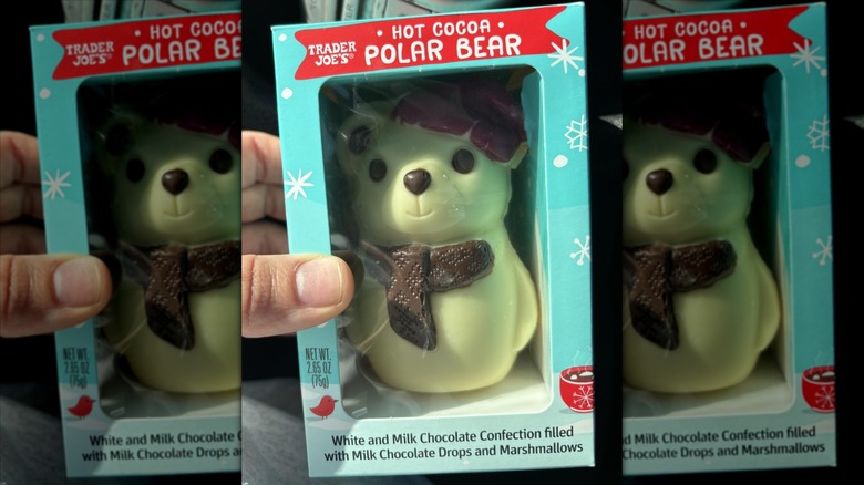 A person holding a Trader Joe's Hot Cocoa Polar Bear