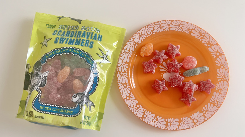Plate with Super Sour Scandinavian Swimmers next to packaged version