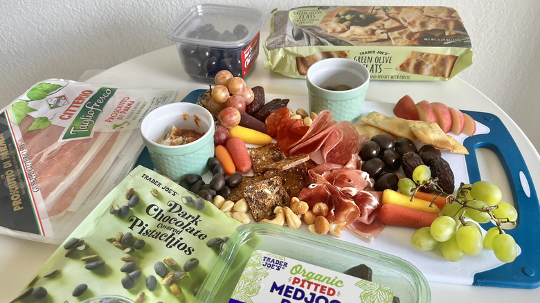 Trader Joe's items on a cutting board surrounded by the packages