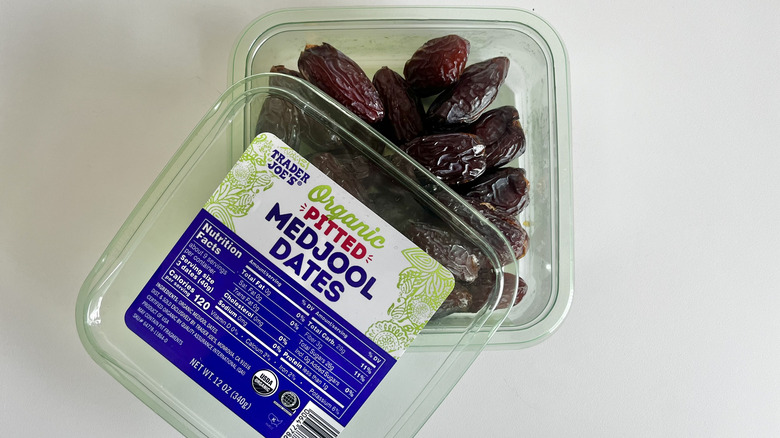 Trader Joe's medjool dates container with the lid half off