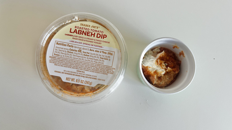 Trader Joe's labneh dip container with a small ramekin of dip next to it