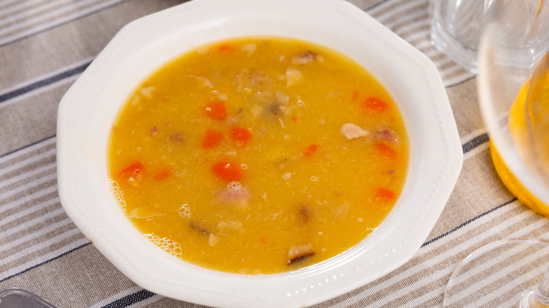 Yellow pea soup in a white bowl
