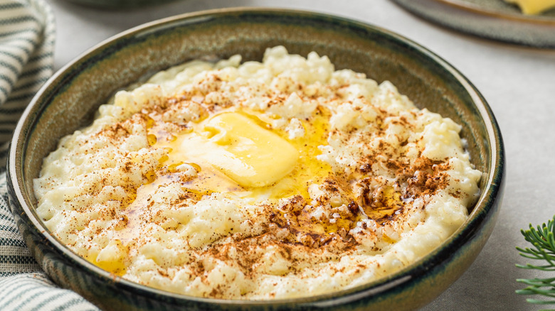 Warm rice pudding with butter and cinnamon on top