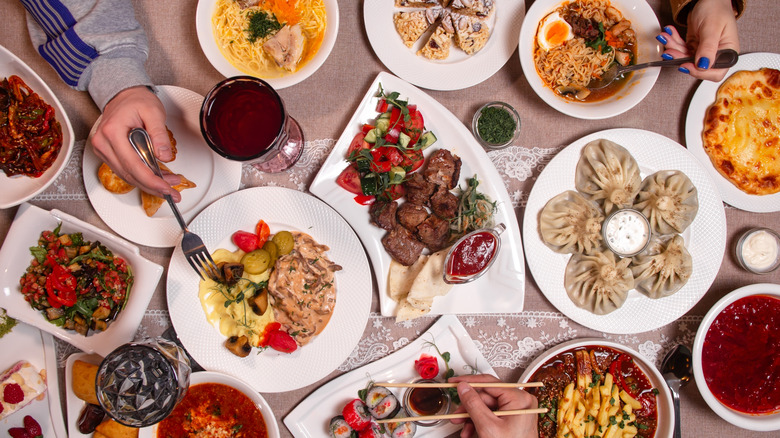 Top down view of multiple dishes of food from around the world
