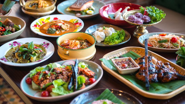Various plates of traditional Thai foods