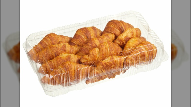 Bakery croissants in plastic container