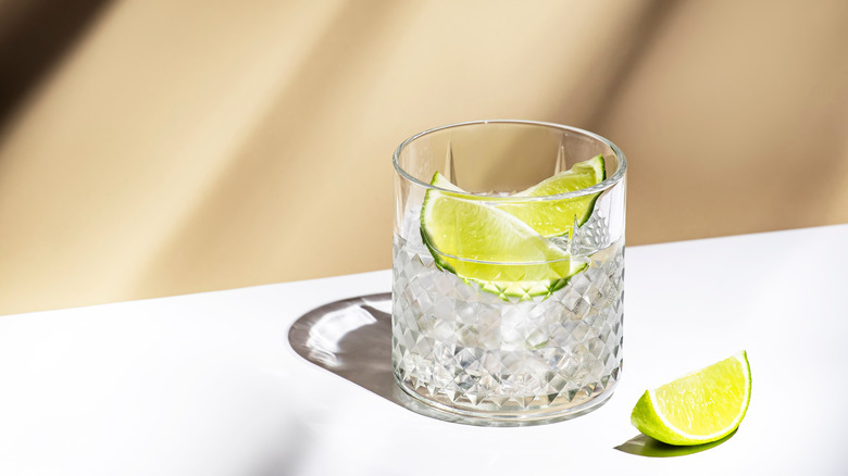 Cocktail made with white Rhum Agricole and slices of lime