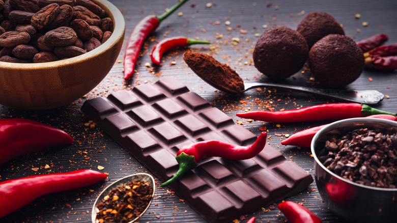 Chili peppers, chocolate bars, cocoa, and red pepper flakes.