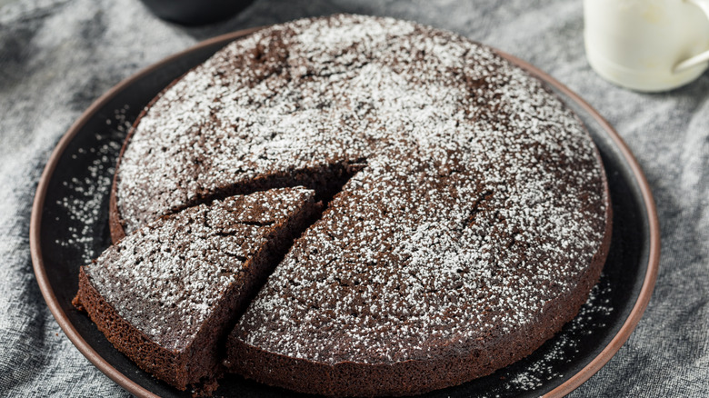 Chocolate olive oil cake sprinkled with powdered sugar.