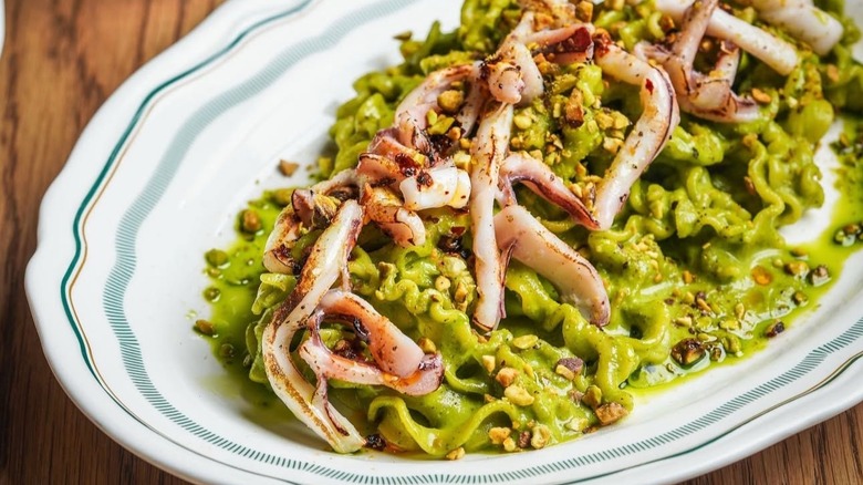 Mafaldine served with green sauce and seafood
