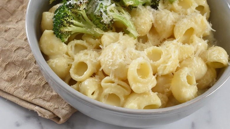 Shellbow pasta with brocolli, sprinkled with Parmesan cheese