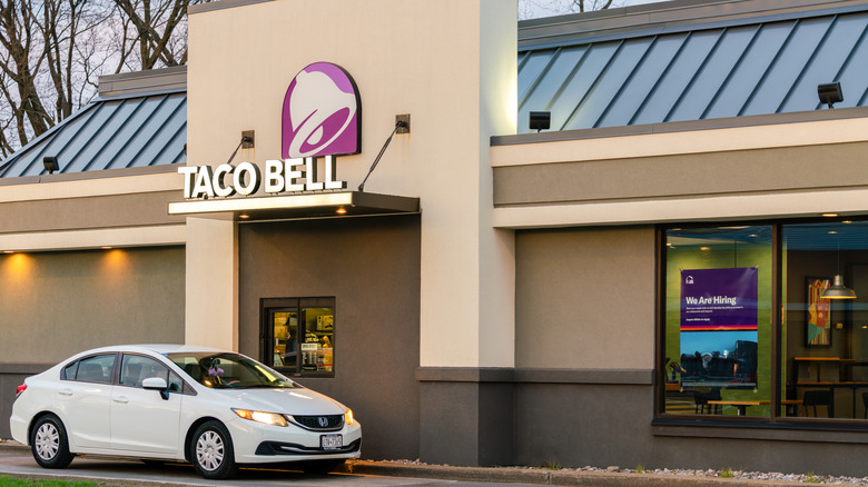 White car pulled up to Taco Bell drive-thru window