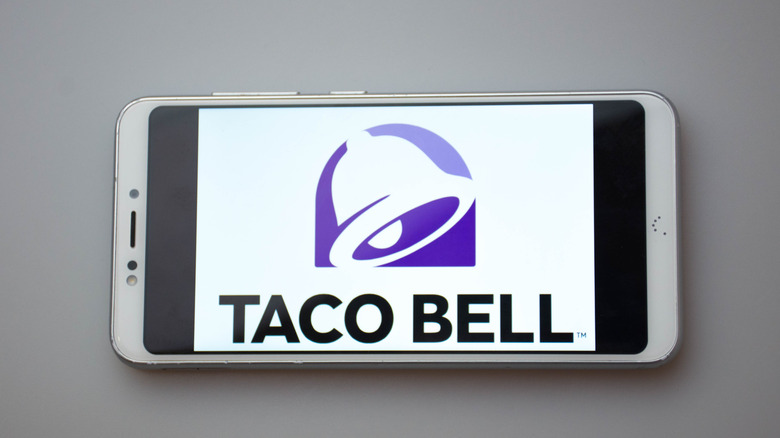 Phone with Taco Bell logo on screen