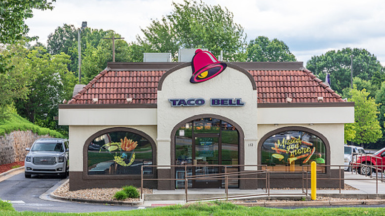 Outside an old-style Taco Bell nestled in the trees