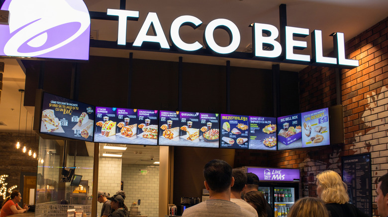 View of digital Taco Bell menu hung up in restaurant