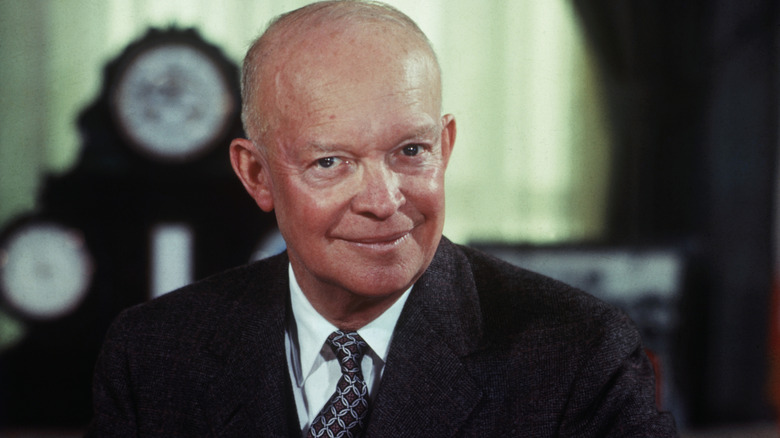 color photo of Dwight D. Eisenhower with clock in background