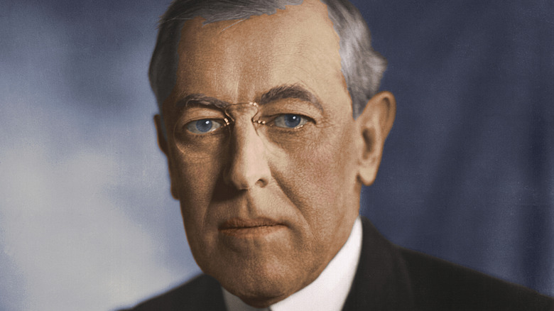 close up color portrait of Woodrow Wilson against grey background