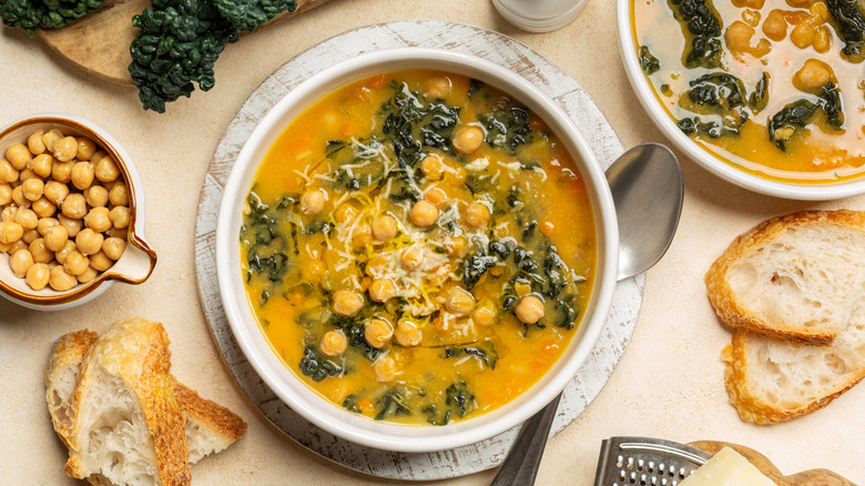 chickpea soup in a bowl served with slices of bread