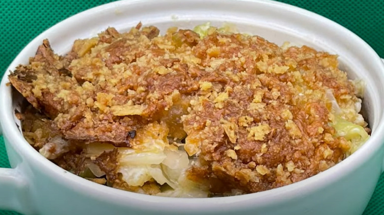 Crushed cracker-topped cabbage casserole in white baking dish