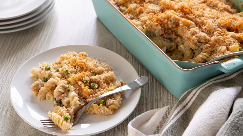 Tuna noodle casserole in baking dish and on plate